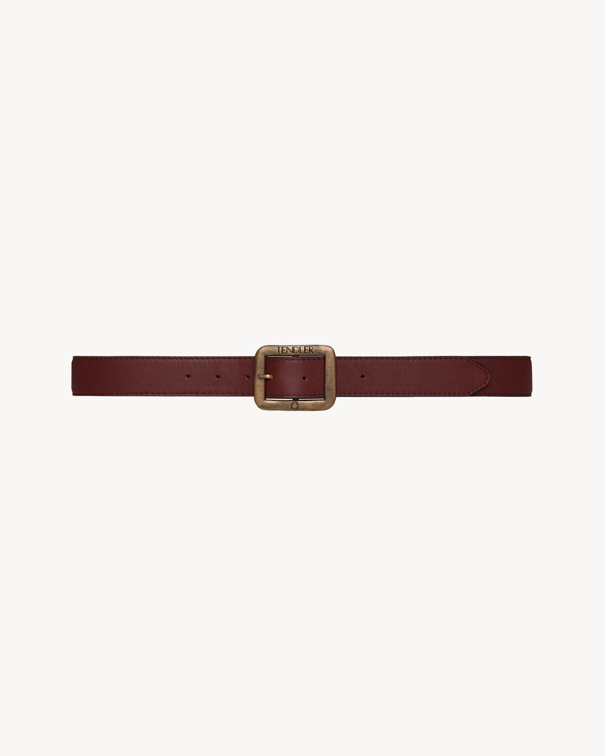 TENDLER burgundy pebbled Italian leather belt featuring a structured square antiqued brass buckle with engraved logo hardware.